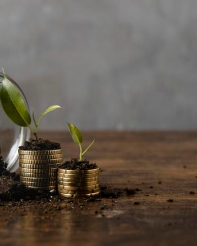 jar-with-dirt-stacked-coins-with-copy-space