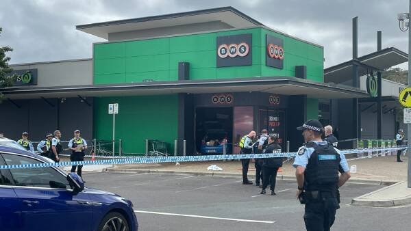 Child dies after car crashes through window at south Canberra shops