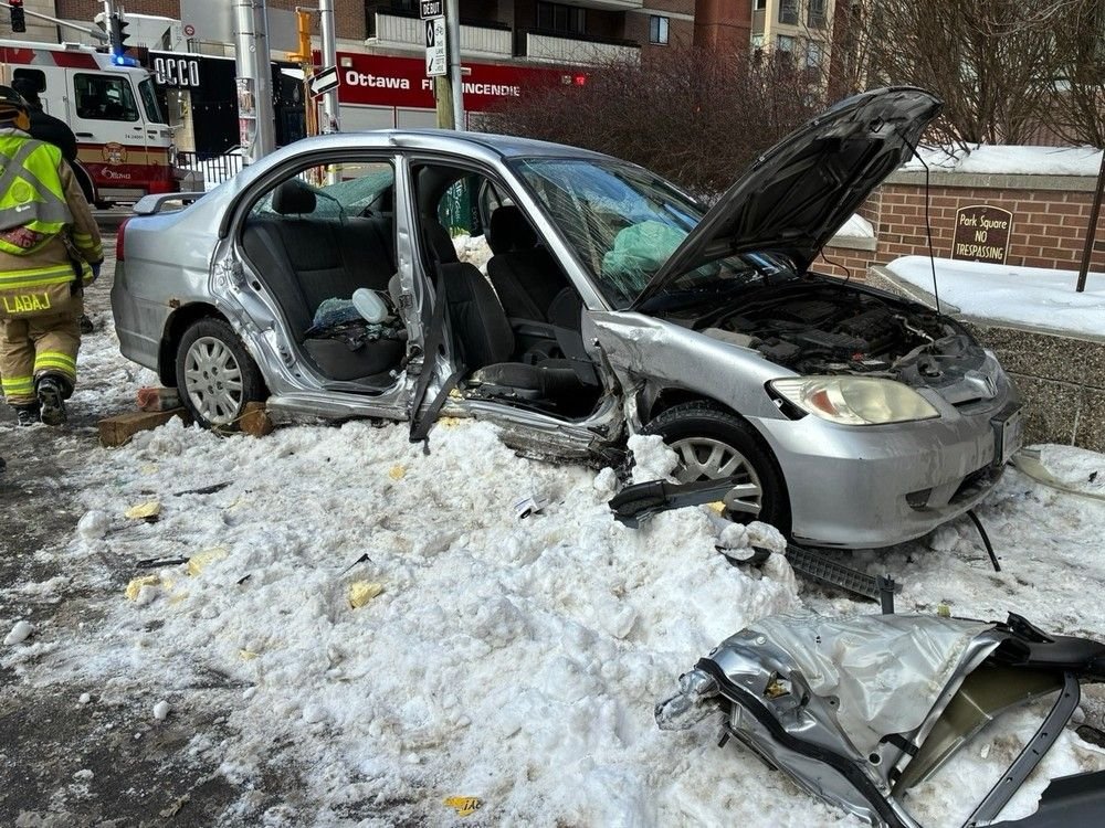 Firefighters free car passenger trapped in downtown crash