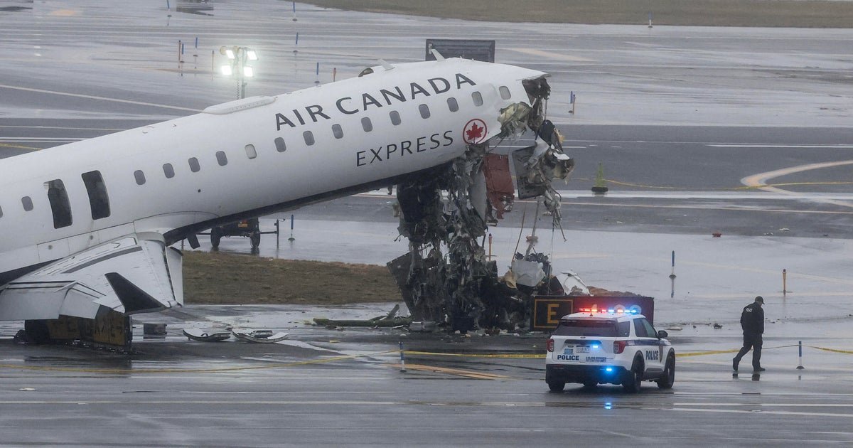 2 pilots killed as plane and fire-rescue truck collide at LaGuardia Airport